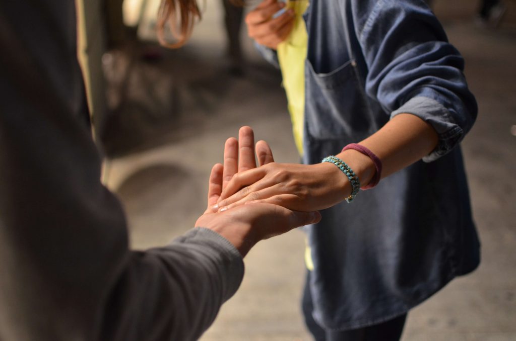 Man and women holding hand closeup